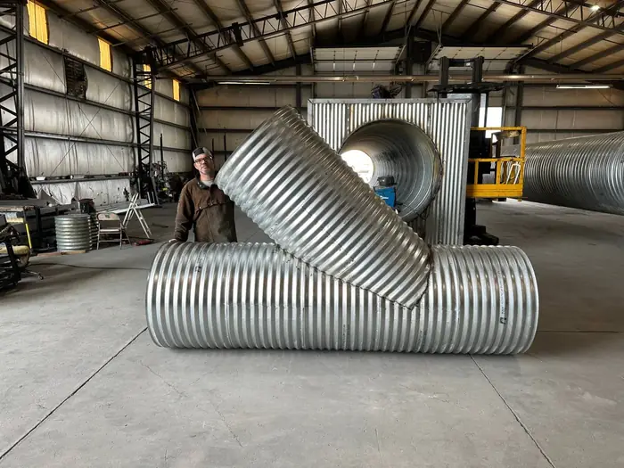 36 inch corrugated metal wye fitting on a fabrication shop floor