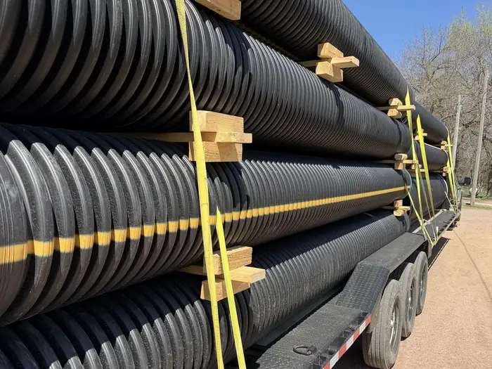 Full trailer load of culvert pipe, strapped and blocked for delivery across Colorado