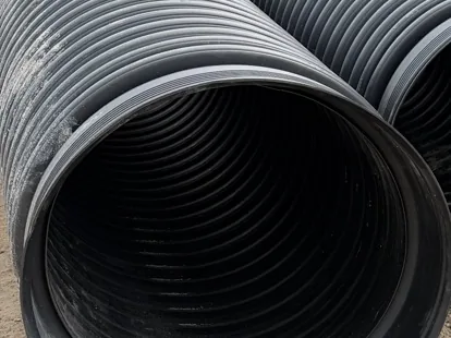 HDPE culvert pipe close-up, corrugated exterior, smooth interior